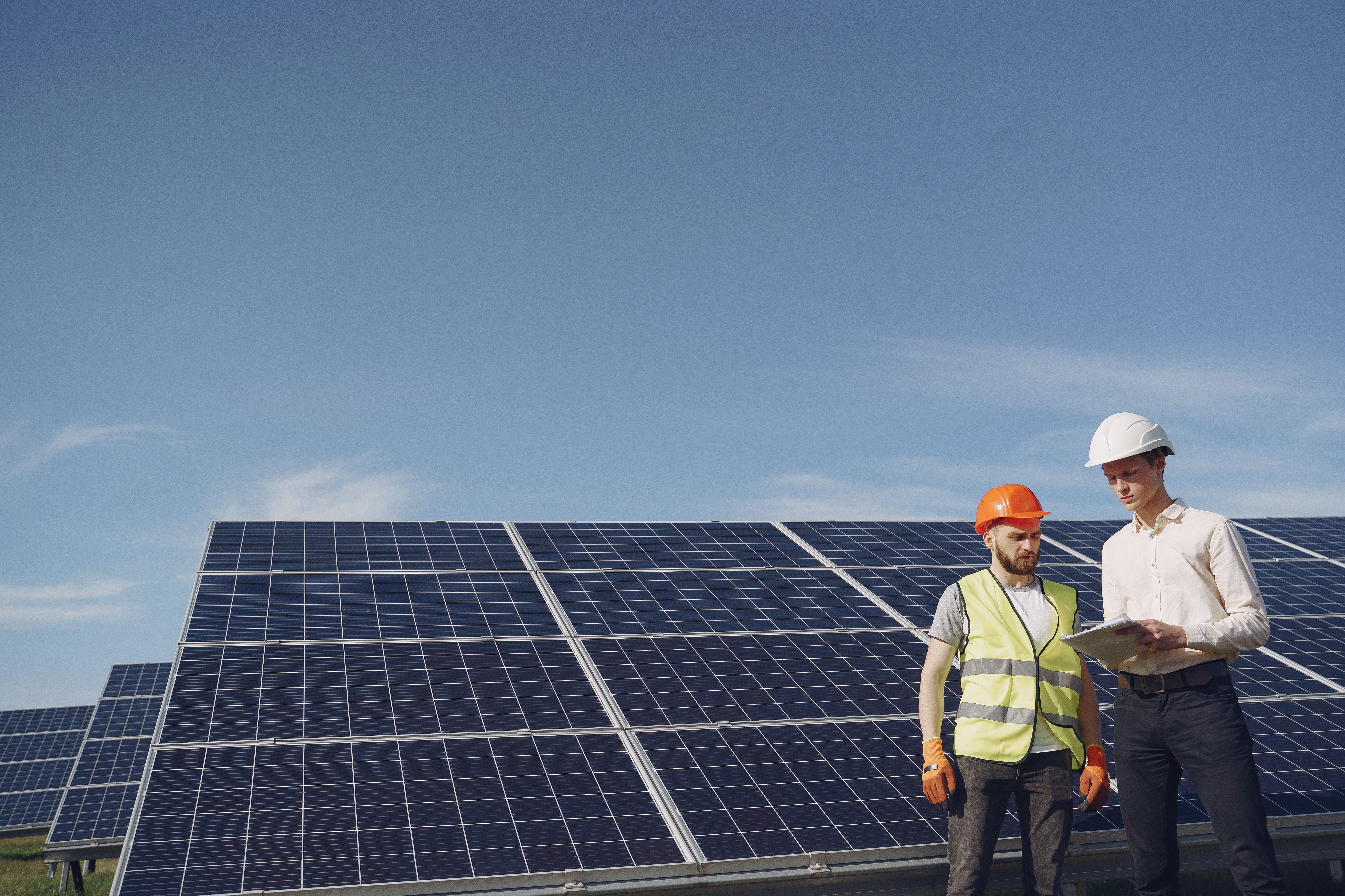 Engineers and construction workers at a solar installation site